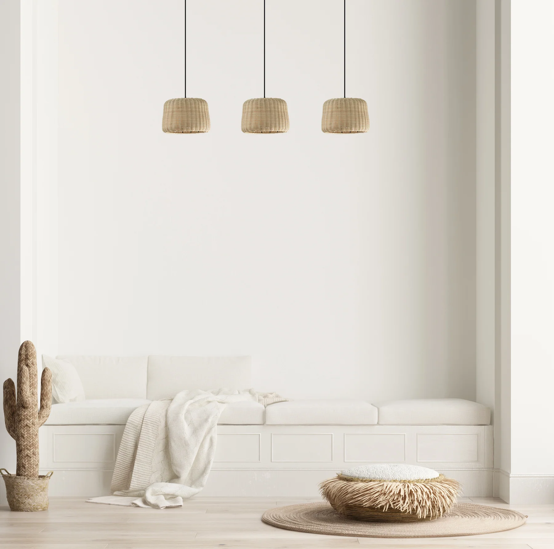 Banquette blanche avec suspensions en fibres naturelles, pouf texturé et décoration épurée dans un intérieur lumineux.