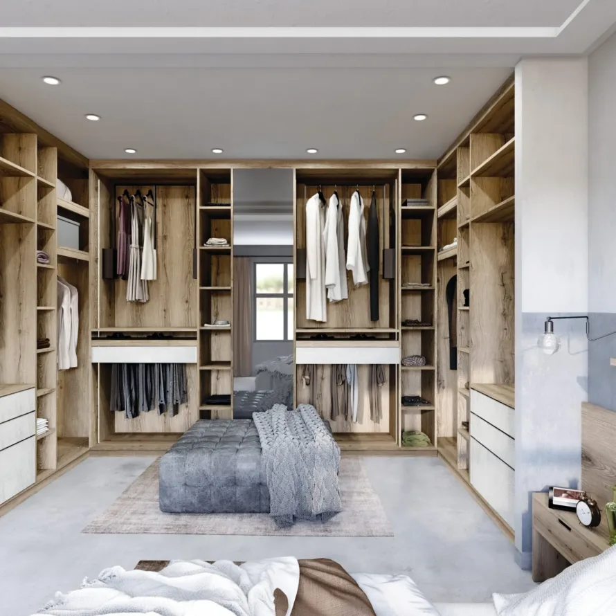 Dressing sur mesure ouvert avec penderies, tiroirs, étagères et décor bois intégré dans une chambre lumineuse.