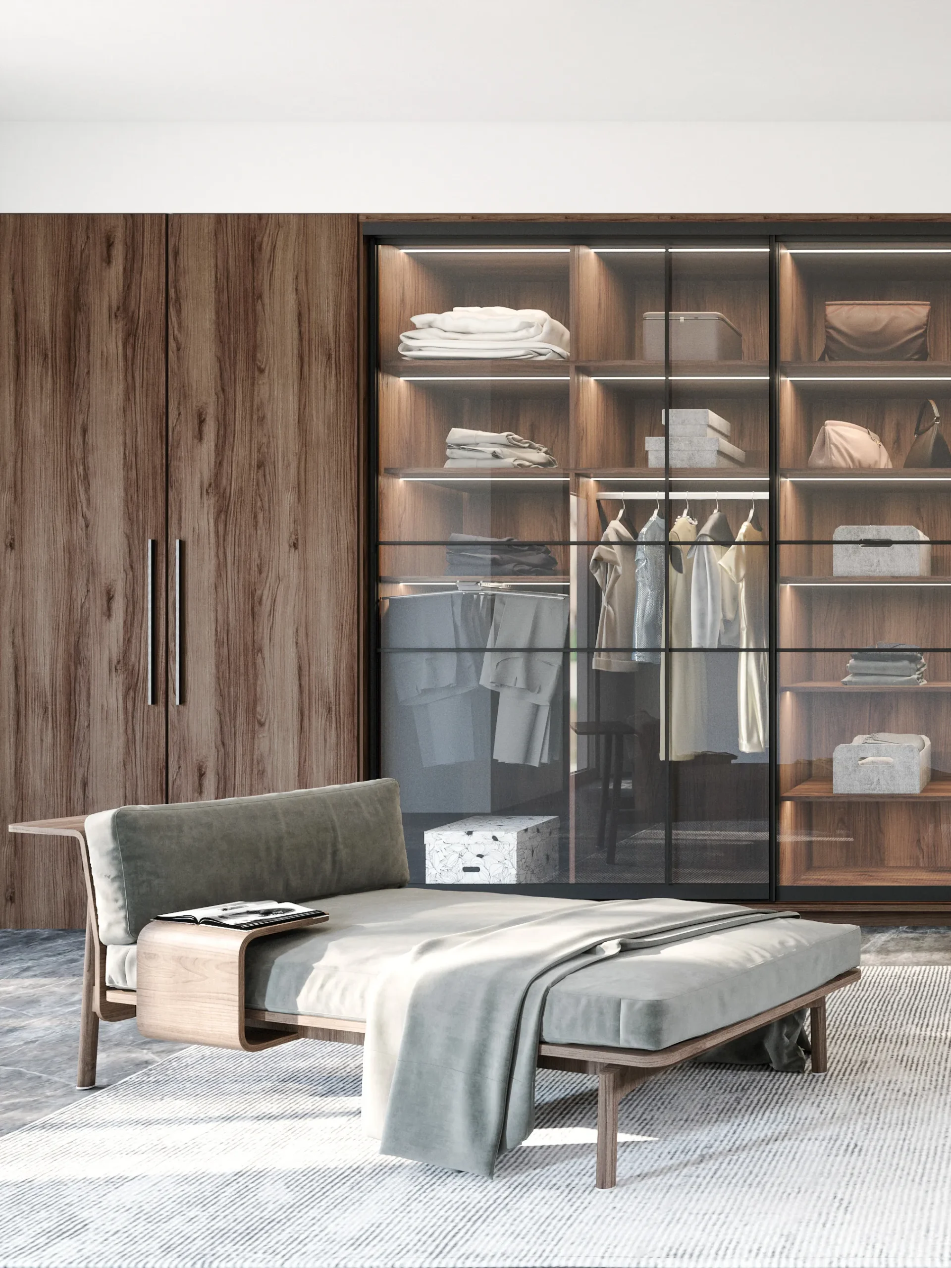 Dressing sur mesure avec façades vitrées noires, éclairage intégré, rangements visibles et méridienne installée dans une suite élégante et lumineuse.