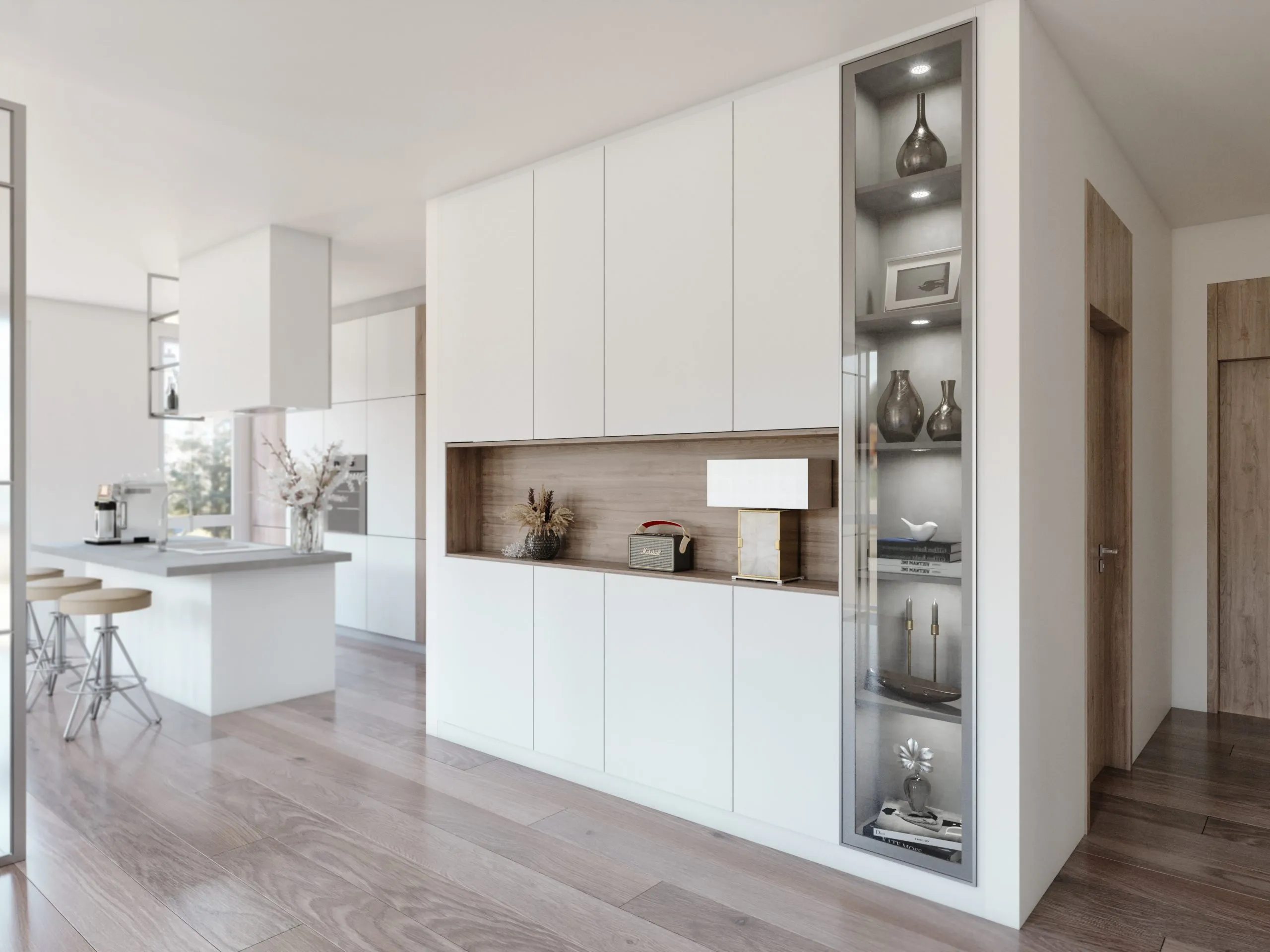 Placard sur mesure blanc avec niche décor bois et colonne vitrée éclairée dans un intérieur ouvert sur la cuisine.