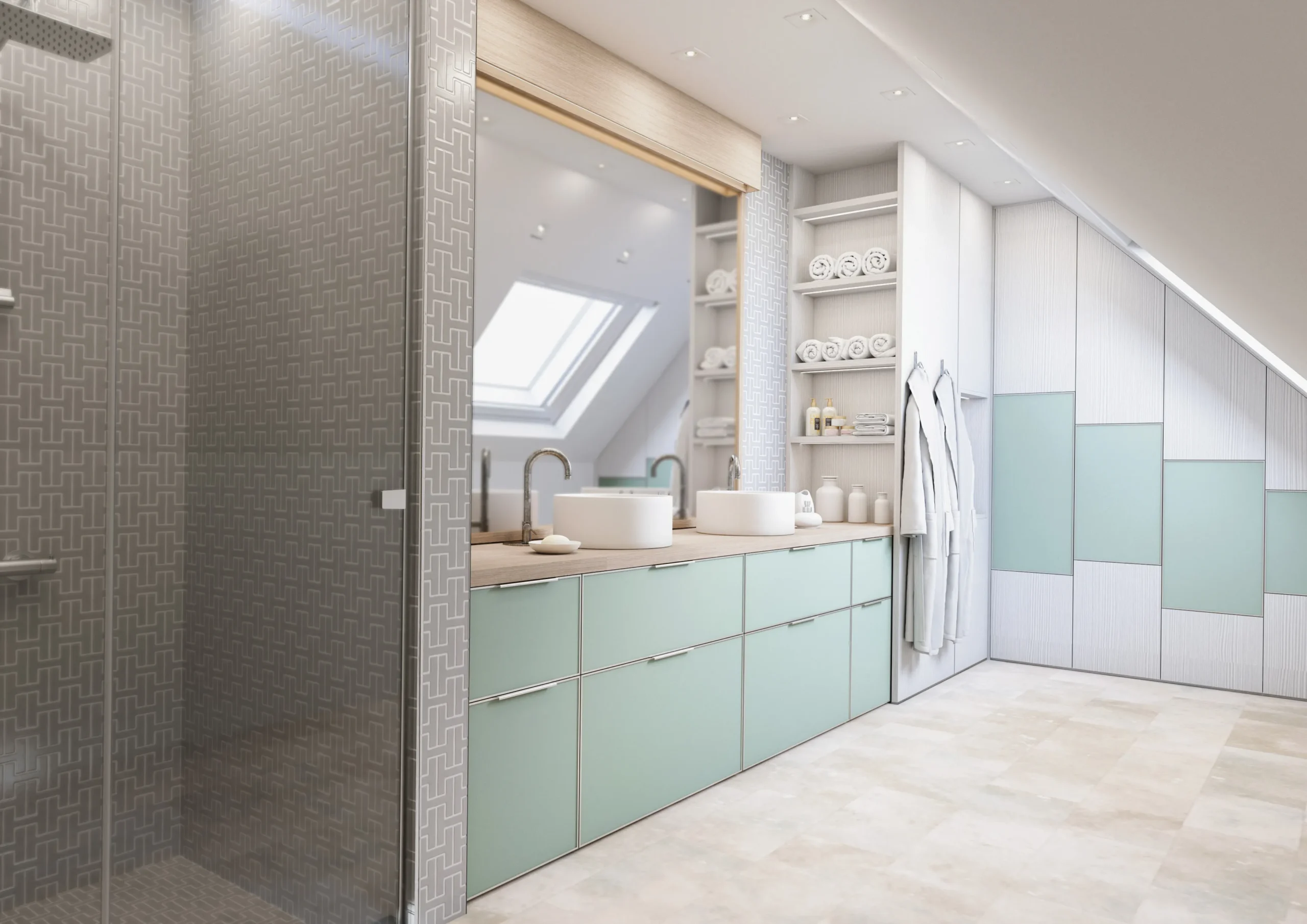 Salle de bain sous combles avec meuble vasque vert d’eau, rangements intégrés, douche vitrée et placards adaptés à la pente.