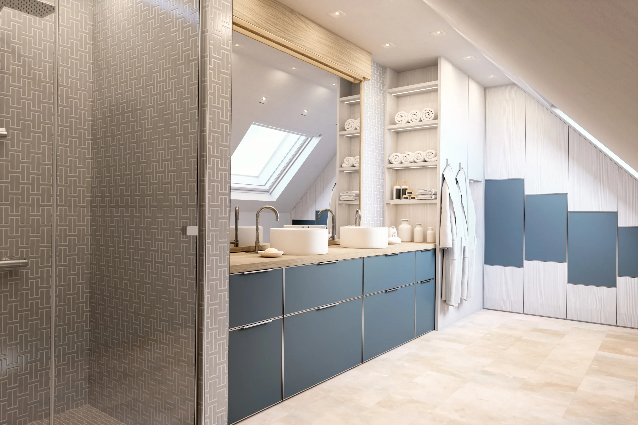 Salle de bain sous combles avec meuble vasque bleu, rangements intégrés, douche vitrée et placards adaptés à la pente.